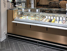 Rosa: deli/pastry with custom front stone ledge top